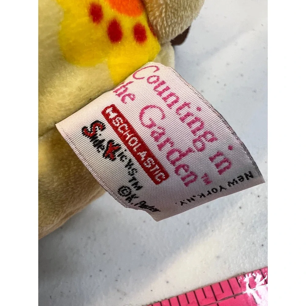 Scholastic Counting in the Garden Plush Dog Backpack Soft Magalina Yellow flower